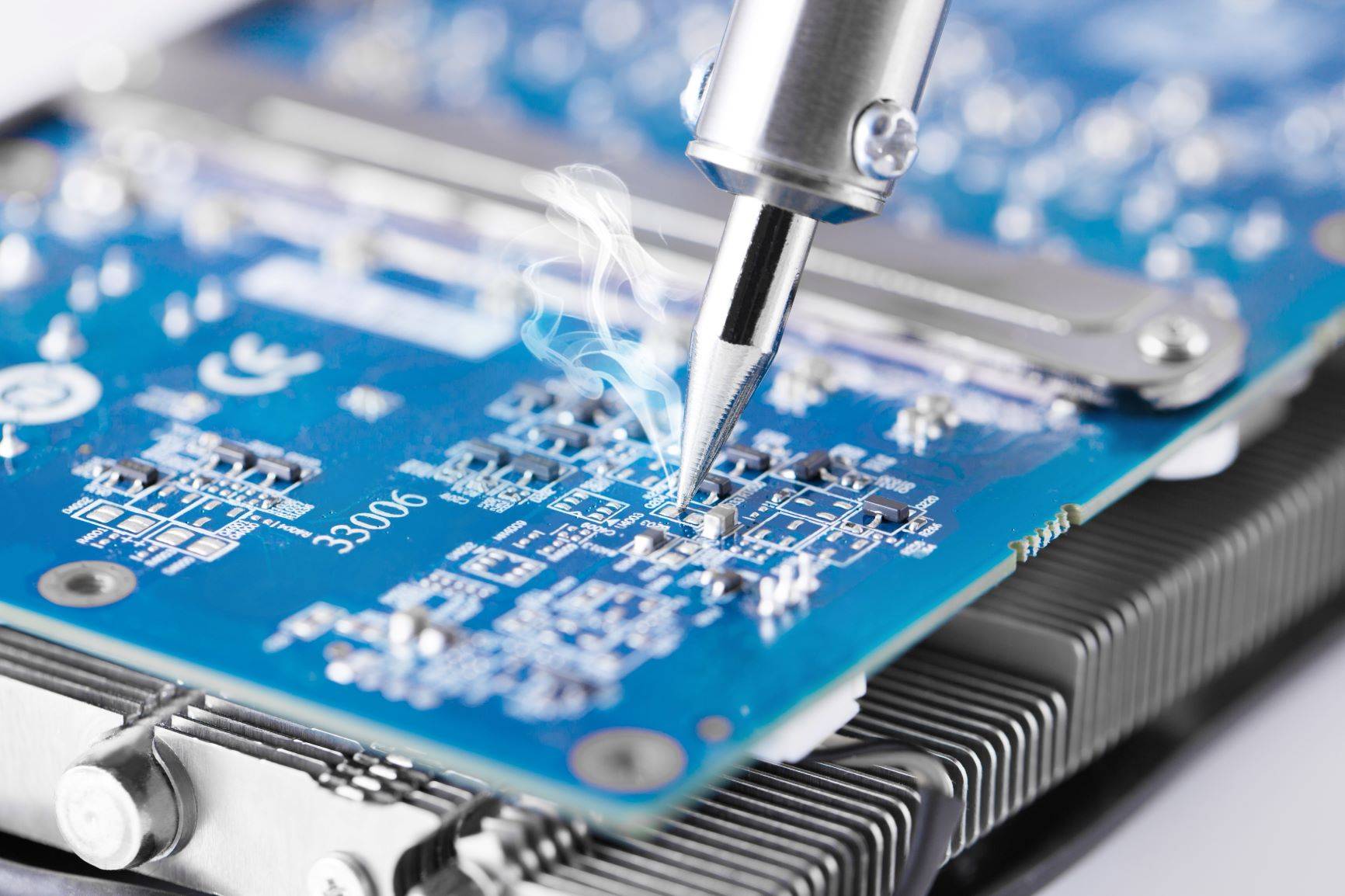 Soldering iron being used on PCB board